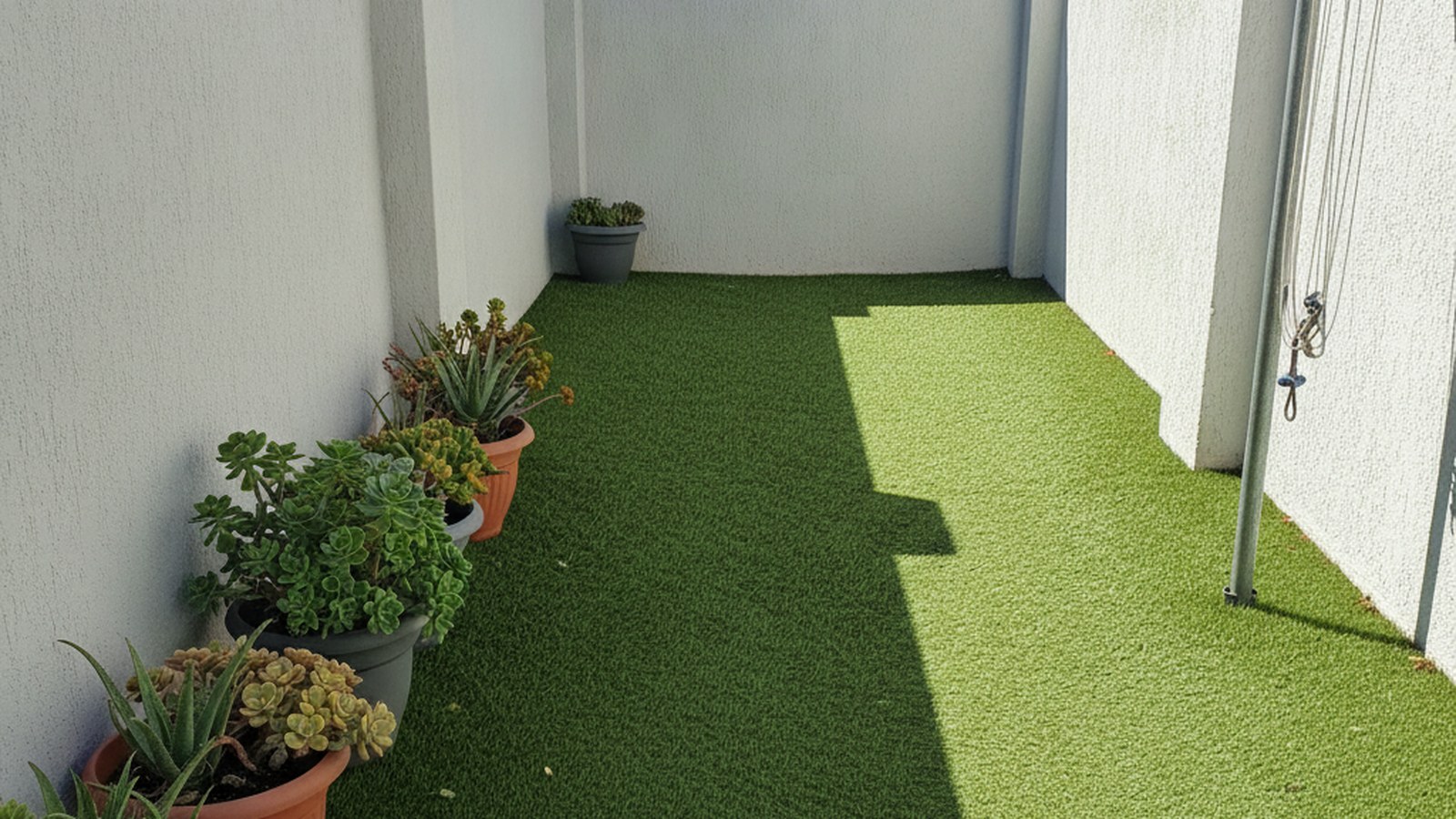 Compact Bellville townhouse courtyard laid with artificial grass