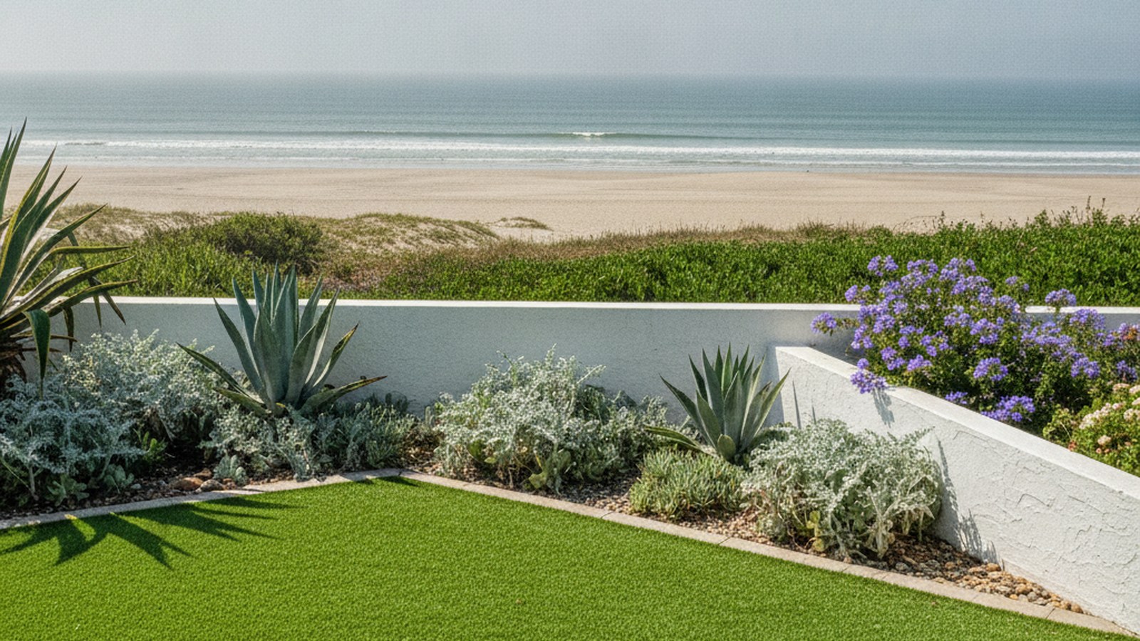 Artificial grass lawn at a Strand coastal home in bright sea light